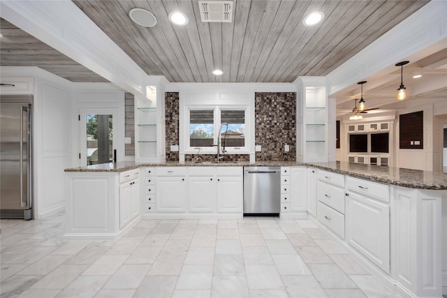4031 Fernwood Dr, Houston, TX 77021 - kitchen featuring a peninsula, stainless steel appliances, a ceiling fan, wooden ceiling, and white cabinets