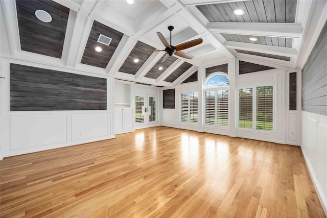 4031 Fernwood Dr, Houston, TX 77021 - unfurnished living room featuring a decorative wall, ceiling fan, light wood-style flooring, french doors, and wainscoting