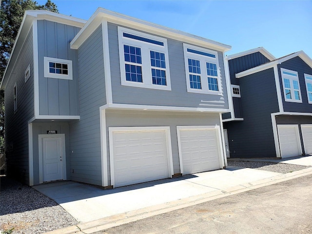 4933 Dalhart Dr, Spring, TX 77379 - view of front of house with board and batten siding and a garage