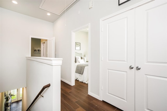 4933 Dalhart Dr, Spring, TX 77379 - corridor with an upstairs landing, attic access, dark wood-type flooring, recessed lighting, and baseboards