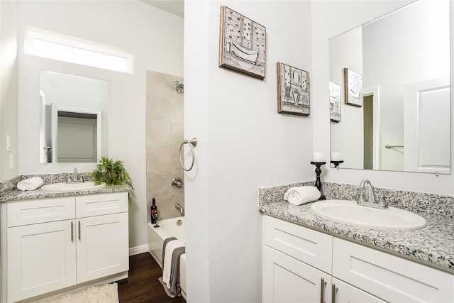 4933 Dalhart Dr, Spring, TX 77379 - bathroom featuring vanity, shower / tub combination, and wood finished floors
