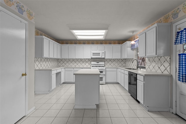 16418 Great Frst, Humble, TX 77346 - kitchen featuring white appliances, backsplash, a kitchen island, and light countertops