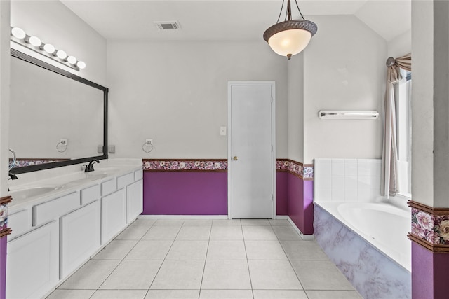 16418 Great Frst, Humble, TX 77346 - bathroom featuring double vanity, a bath, vaulted ceiling, and tile patterned flooring