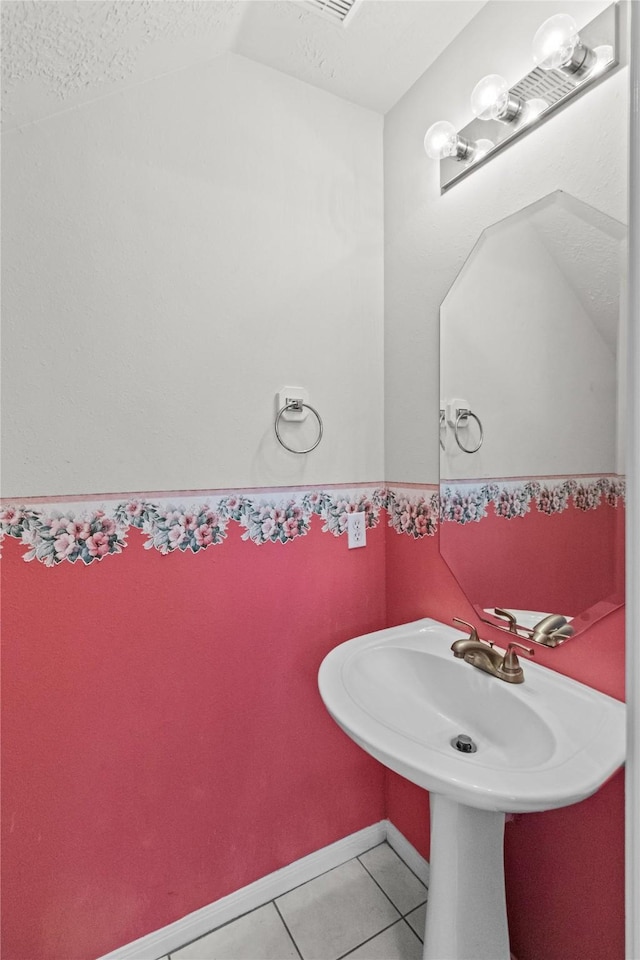 16418 Great Frst, Humble, TX 77346 - bathroom with tile patterned flooring, lofted ceiling, and a textured ceiling