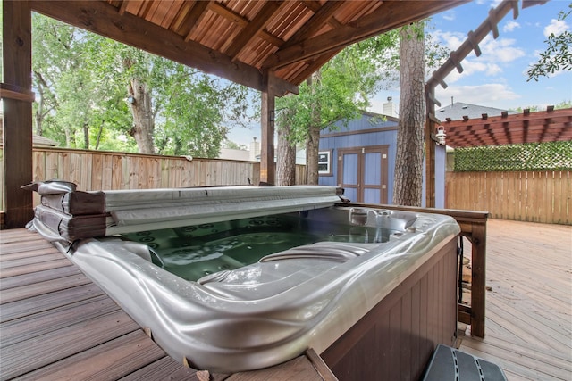 16418 Great Frst, Humble, TX 77346 - deck featuring a covered hot tub and an outbuilding