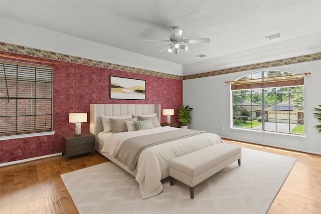 16418 Great Frst, Humble, TX 77346 - bedroom featuring wallpapered walls, hardwood / wood-style floors, and a ceiling fan