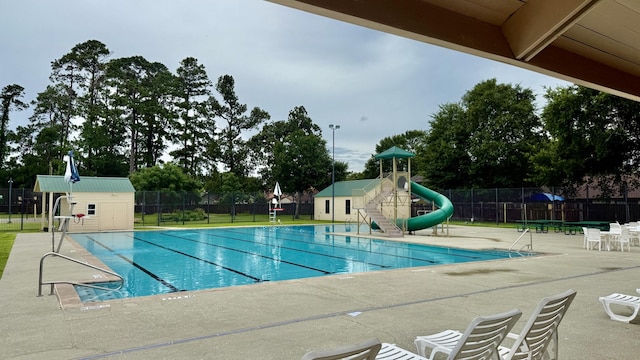 16418 Great Frst, Humble, TX 77346 - community pool with a patio area, a water slide, and an outbuilding