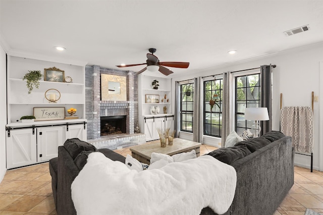 939 Mulberry Ridge Way, Houston, TX 77062 - living room with ceiling fan, built in features, a brick fireplace, crown molding, and recessed lighting