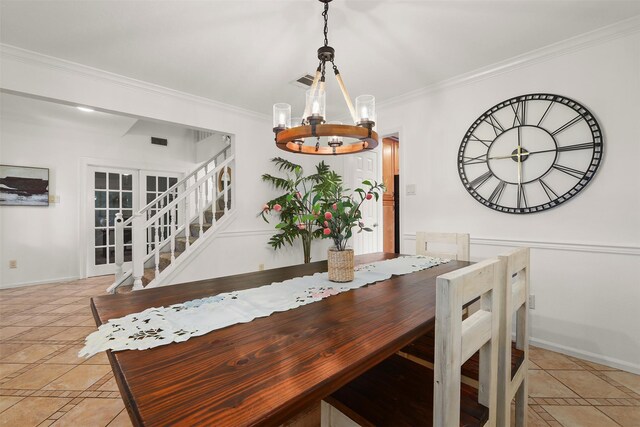 939 Mulberry Ridge Way, Houston, TX 77062 - dining space with a chandelier, crown molding, baseboards, inlaid floor details, and light tile patterned flooring