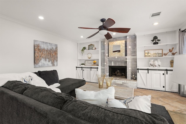 939 Mulberry Ridge Way, Houston, TX 77062 - living room with ornamental molding, recessed lighting, a ceiling fan, a brick fireplace, and built in shelves