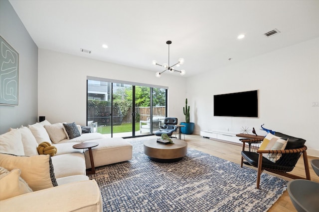 823 Aurora St, Houston, TX 77009 - living room with a chandelier, wood finished floors, and recessed lighting