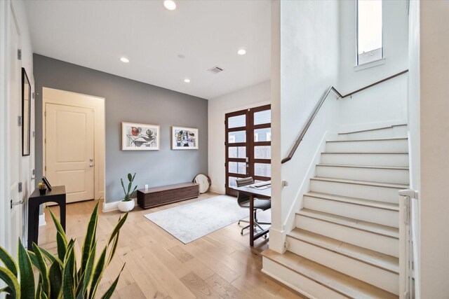 823 Aurora St, Houston, TX 77009 - foyer entrance with stairs, light wood-style floors, and recessed lighting