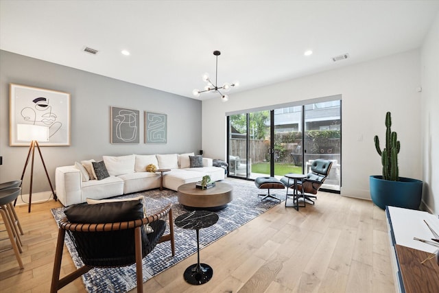 823 Aurora St, Houston, TX 77009 - living area with light wood-type flooring, a chandelier, and recessed lighting