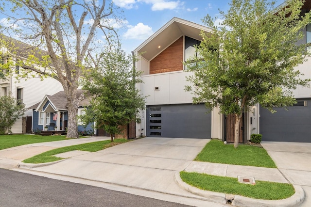 823 Aurora St, Houston, TX 77009 - modern home featuring an attached garage and concrete driveway