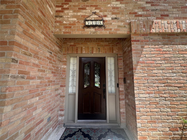 5306 Manor Glen Dr, Kingwood, TX 77345 - doorway to property with brick siding