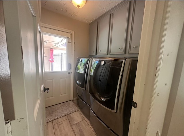 5306 Manor Glen Dr, Kingwood, TX 77345 - washroom with washing machine and clothes dryer and cabinet space