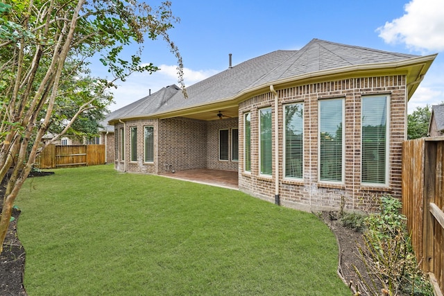 2014 Karankawa Trl, Katy, TX 77493 - back of house featuring ceiling fan, brick siding, a patio area, and roof with shingles
