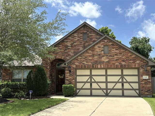 17207 Forest Ridge Pt, Houston, TX 77084 - view of front facade featuring concrete driveway, brick siding, and a garage