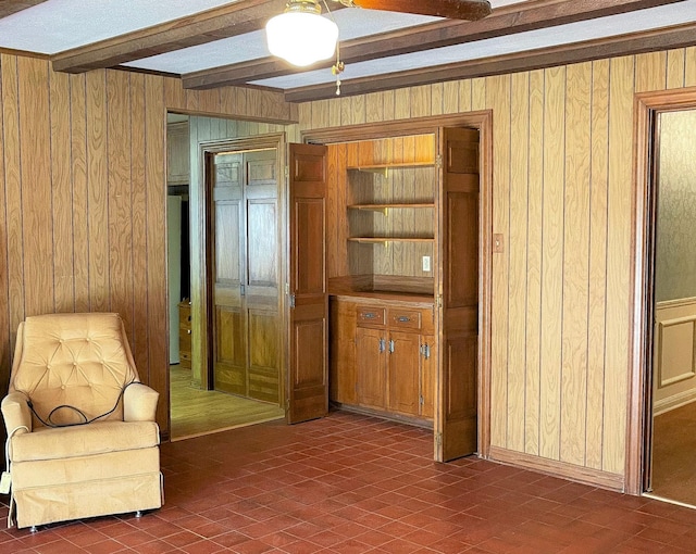 409 W Collier St, Jasper, TX 75951 - living area with beam ceiling and wood walls