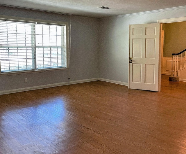 409 W Collier St, Jasper, TX 75951 - unfurnished room featuring wood finished floors and ornamental molding