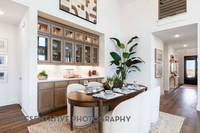 2334 Vargas St, Magnolia, TX 77316 - dining room with dark wood finished floors, baseboards, and a high ceiling