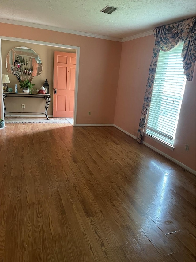 2002 Savanna Ct N, League City, TX 77573 - empty room featuring ornamental molding, wood finished floors, and a textured ceiling