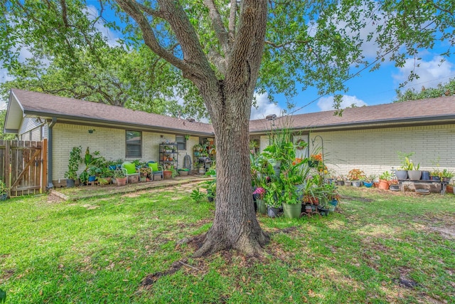 905 Jane Ln, Bryan, TX 77802 - rear view of house featuring brick siding