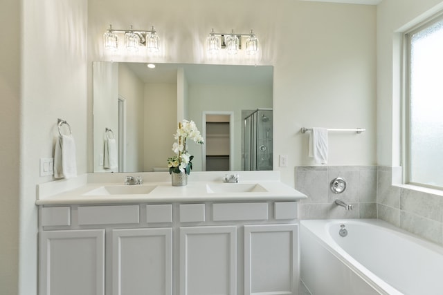 23106 Tindarey Falls Ln, Katy, TX 77493 - full bath with a garden tub, double vanity, and a shower stall
