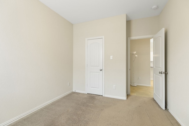 23106 Tindarey Falls Ln, Katy, TX 77493 - unfurnished bedroom featuring light colored carpet and baseboards