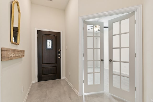 23106 Tindarey Falls Ln, Katy, TX 77493 - entryway with french doors, baseboards, light tile patterned flooring, and a ceiling fan