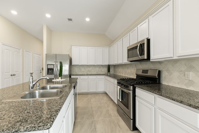 23106 Tindarey Falls Ln, Katy, TX 77493 - kitchen featuring stainless steel appliances, a sink, decorative backsplash, white cabinetry, and recessed lighting