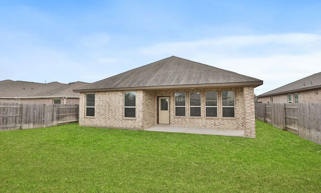 23106 Tindarey Falls Ln, Katy, TX 77493 - rear view of house with brick siding, a patio, and a shingled roof