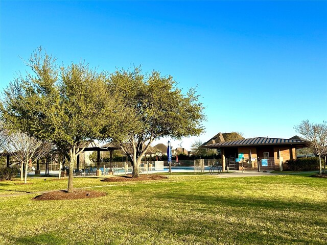 23106 Tindarey Falls Ln, Katy, TX 77493 - surrounding community with a yard