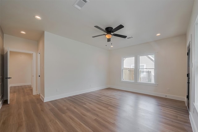 1026 W Cottage St, Houston, TX 77009 - unfurnished room with wood finished floors, recessed lighting, ceiling fan, and baseboards