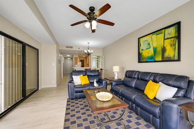 7700 Seawall Blvd Unit 512, Galveston, TX 77551 - living area with light wood-style flooring, a ceiling fan, a chandelier, and baseboards
