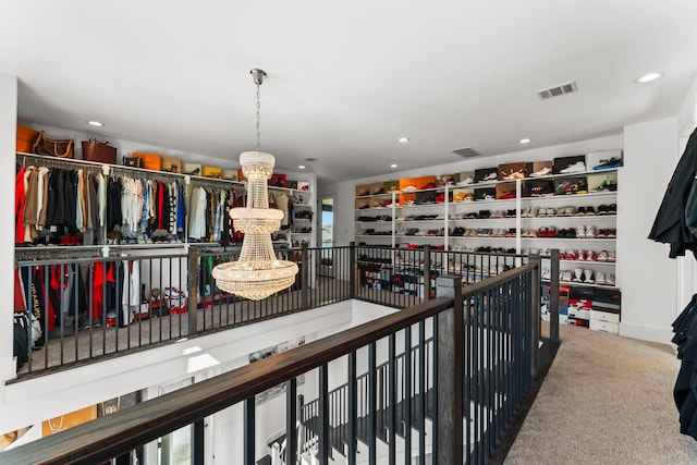 10411 E Rio Grande River Dr, Cypress, TX 77433 - spacious closet featuring a chandelier and carpet floors