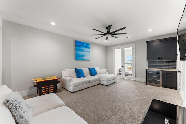 10411 E Rio Grande River Dr, Cypress, TX 77433 - carpeted living room with beverage cooler, a ceiling fan, recessed lighting, baseboards, and french doors