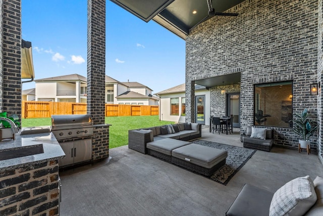 10411 E Rio Grande River Dr, Cypress, TX 77433 - view of patio / terrace with outdoor lounge area, a sink, and outdoor dining area