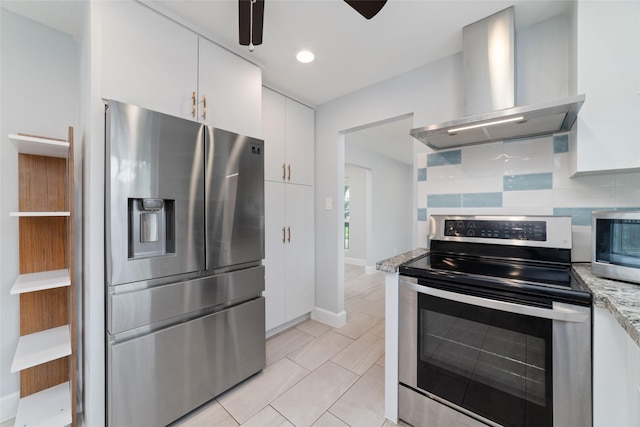 5006 Lymbar Dr, Houston, TX 77096 - kitchen featuring stainless steel appliances, wall chimney range hood, backsplash, white cabinets, and a ceiling fan