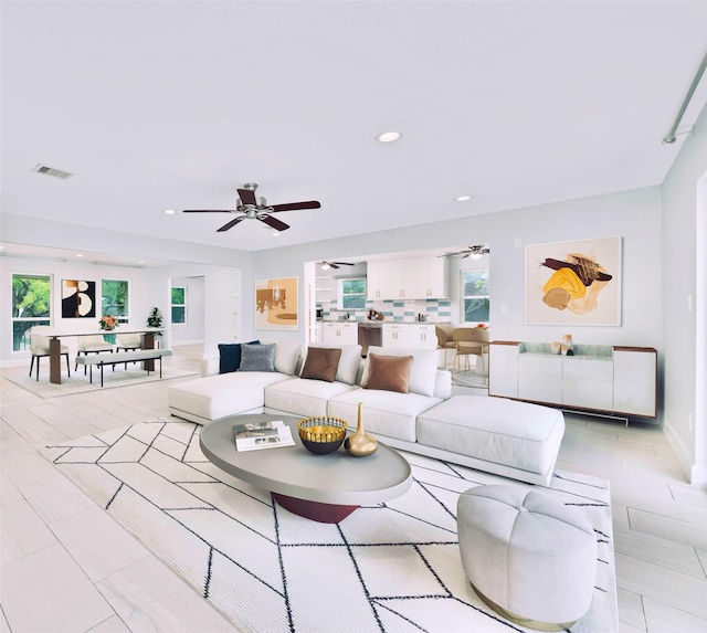 5006 Lymbar Dr, Houston, TX 77096 - living room with ceiling fan, plenty of natural light, recessed lighting, and baseboards