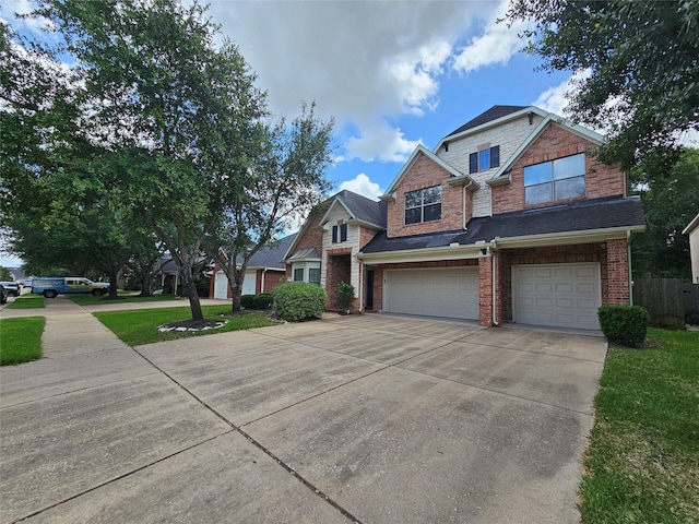 21235 Pennshore Ln, Katy, TX 77450 - view of front of property with concrete driveway, a garage, and brick siding