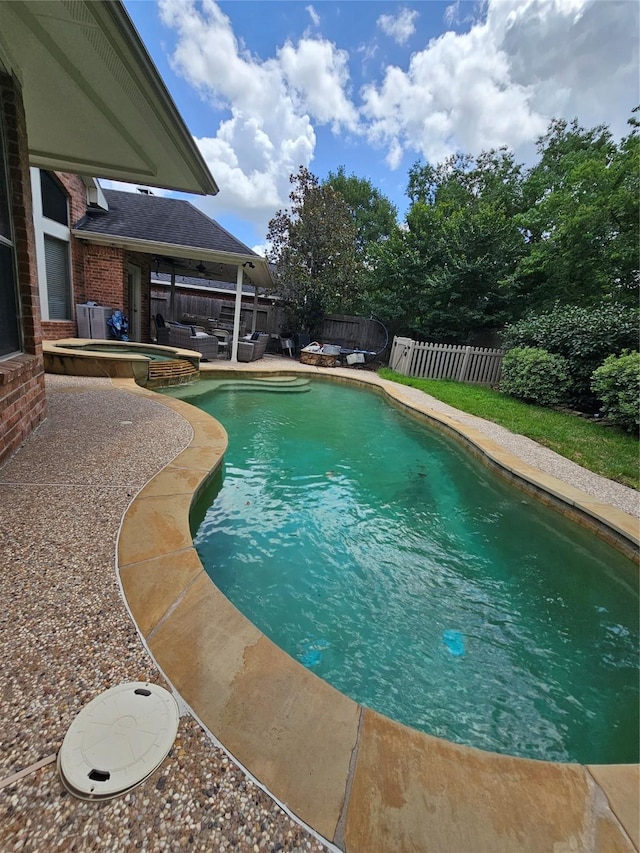 21235 Pennshore Ln, Katy, TX 77450 - view of swimming pool featuring a fenced backyard, a patio, and a pool with connected hot tub