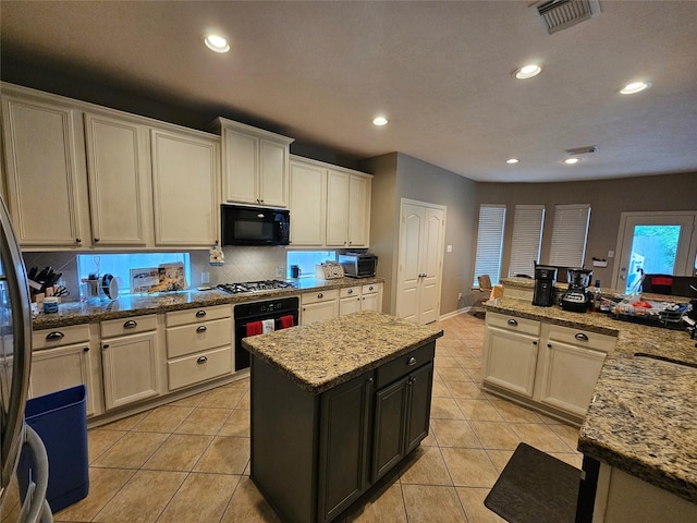 21235 Pennshore Ln, Katy, TX 77450 - kitchen featuring black appliances, a center island, backsplash, light tile patterned floors, and recessed lighting