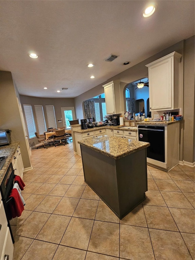 21235 Pennshore Ln, Katy, TX 77450 - kitchen featuring dishwasher, recessed lighting, a peninsula, white cabinetry, and a sink
