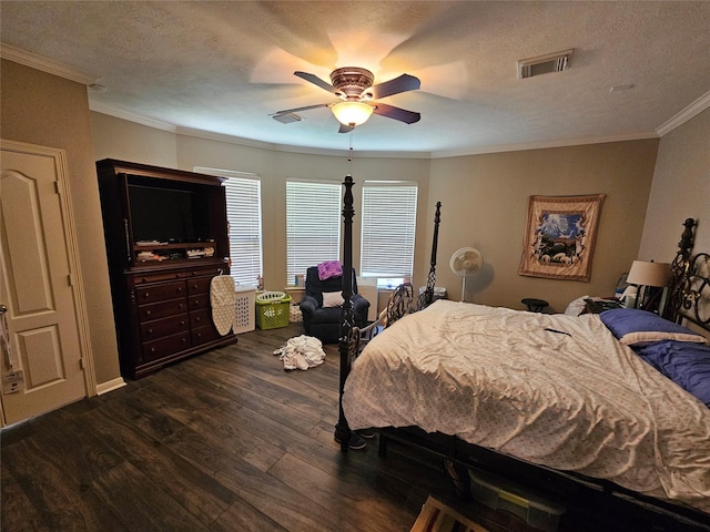 21235 Pennshore Ln, Katy, TX 77450 - bedroom featuring crown molding, dark wood-style flooring, ceiling fan, and a textured ceiling