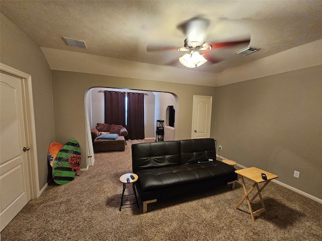 21235 Pennshore Ln, Katy, TX 77450 - living room with carpet floors, arched walkways, a ceiling fan, and baseboards