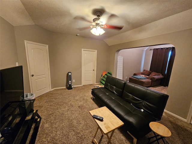 21235 Pennshore Ln, Katy, TX 77450 - carpeted living area featuring lofted ceiling, arched walkways, ceiling fan, and baseboards