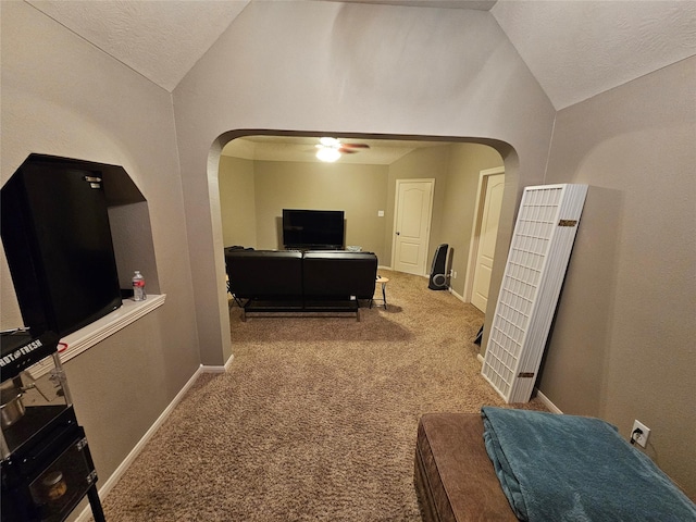 21235 Pennshore Ln, Katy, TX 77450 - living room with lofted ceiling, a heating unit, arched walkways, a ceiling fan, and carpet flooring