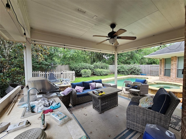 21235 Pennshore Ln, Katy, TX 77450 - fenced backyard with an in-ground hot tub, outdoor lounge area, a patio, and ceiling fan