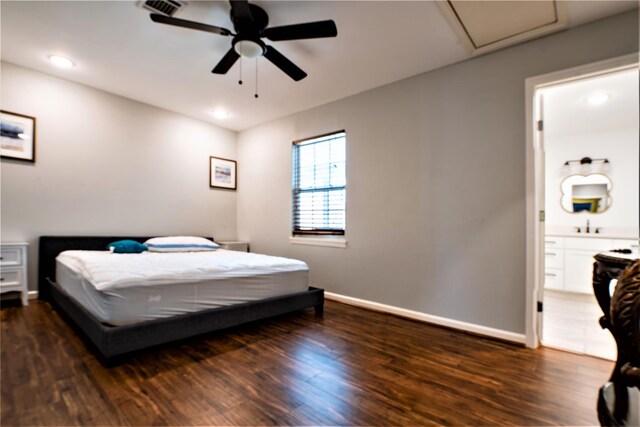 9305 Emnora Ln, Houston, TX 77080 - bedroom with dark wood finished floors, baseboards, attic access, connected bathroom, and recessed lighting